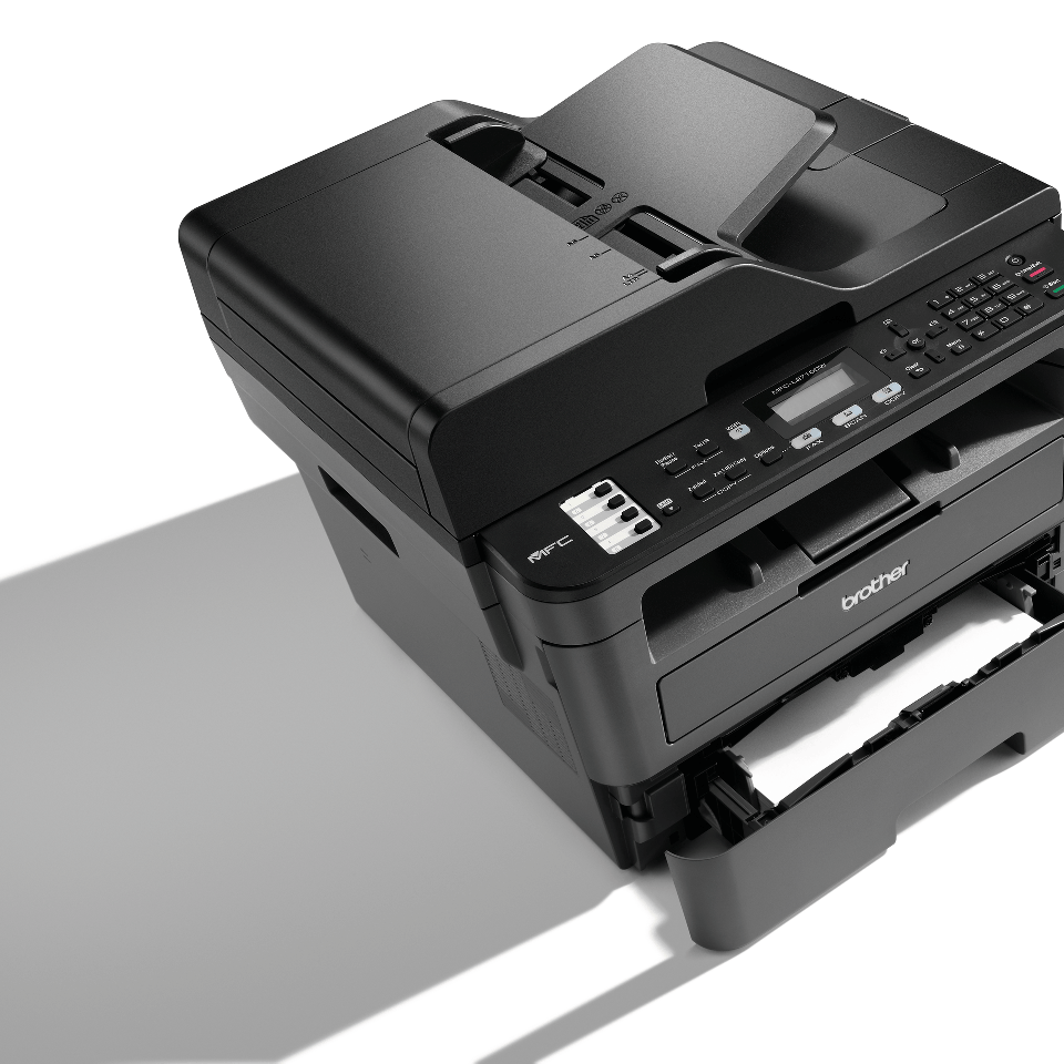 Compact 4-in-1 mono laser printer shadow with paper tray pulled out