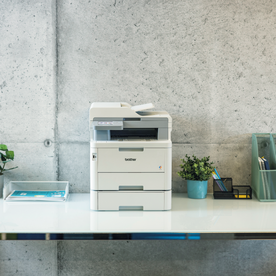 Brother Colour LED device with LT310CL paper tray attached on a desk in an office environment