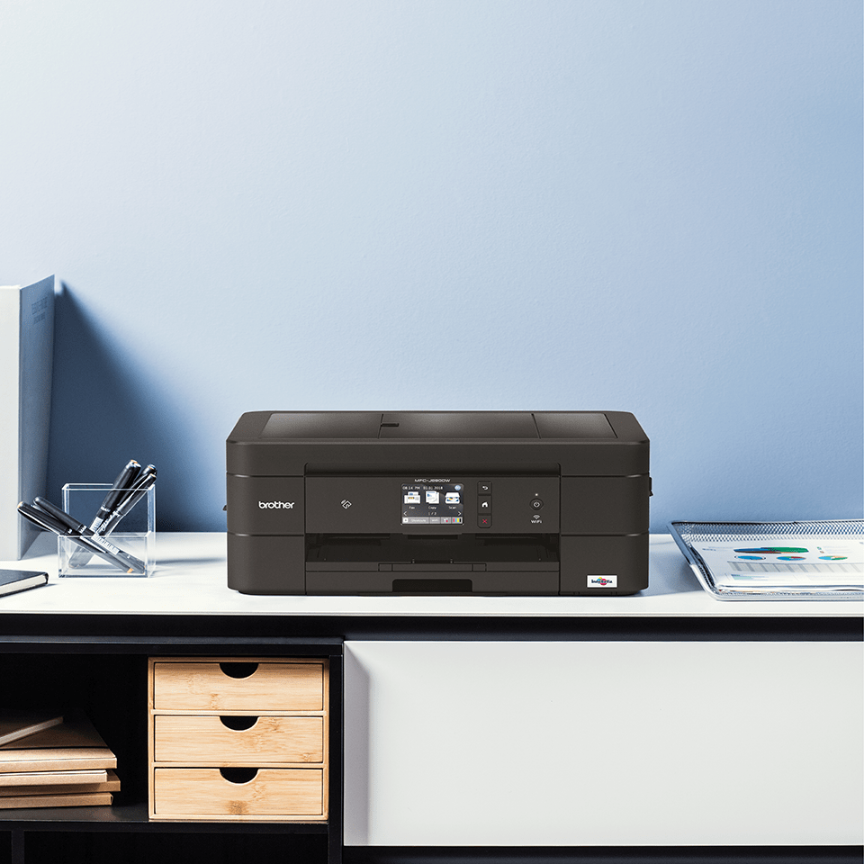 Black inkjet printer on desk with drawers and desk stationery - MFCJ890DW