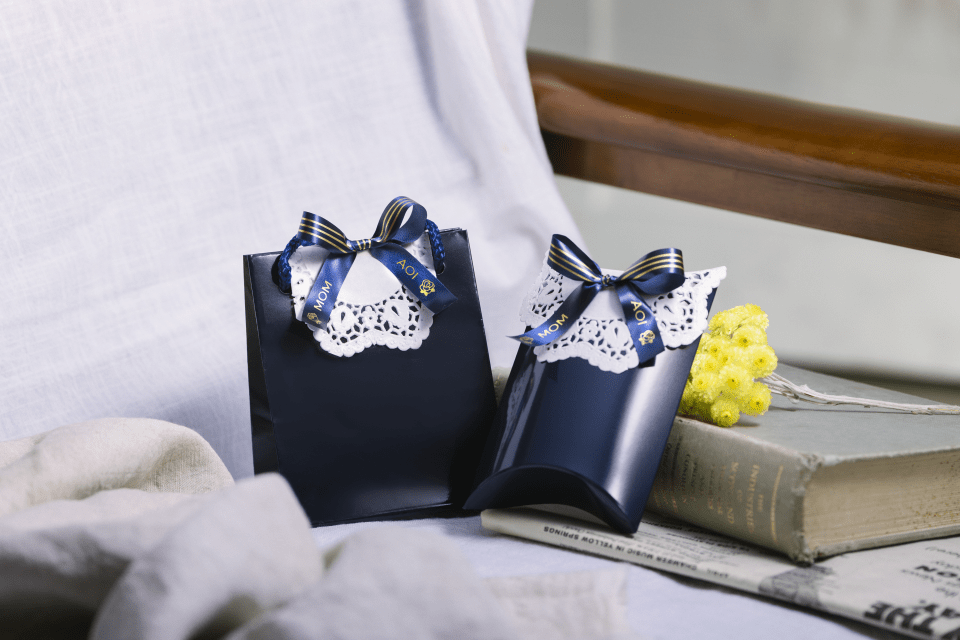 Brother TZe-RN34 satin ribbon tape cassette - gold on navy blue - gift boxes wrapped in personalised ribbons