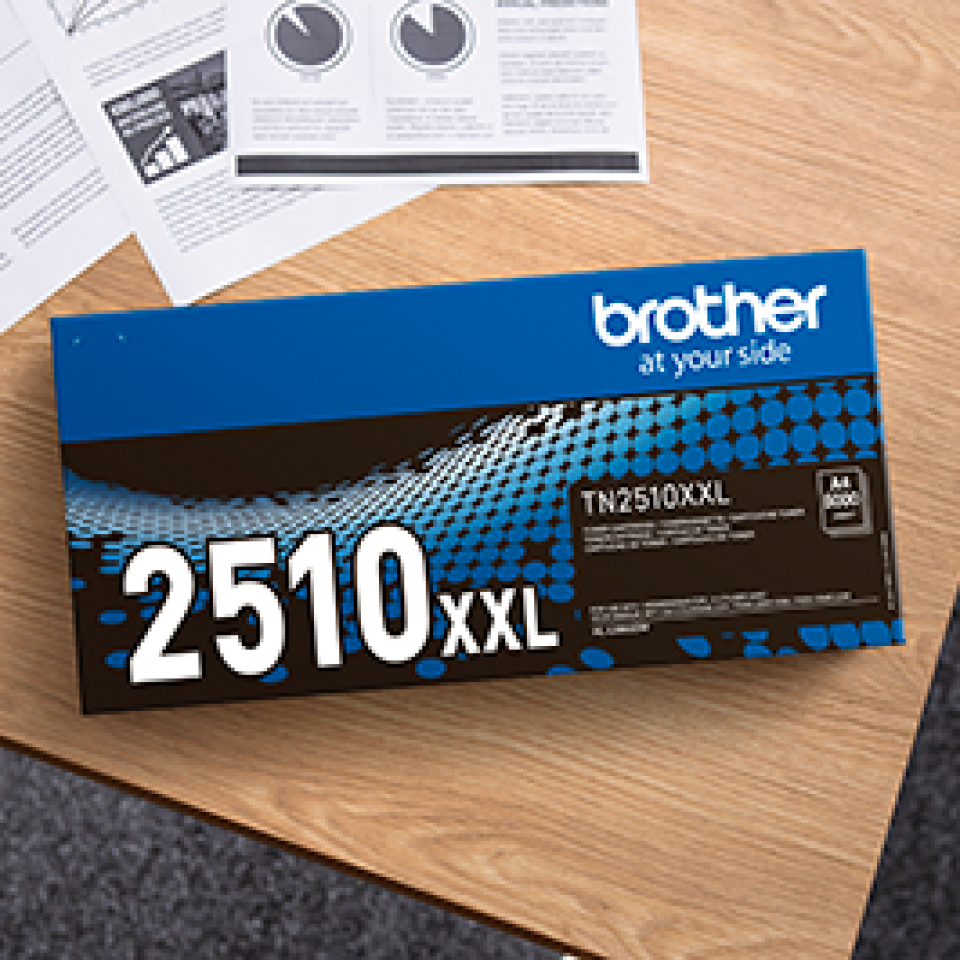 Brother TN2510XXL black toner cartridge on desk