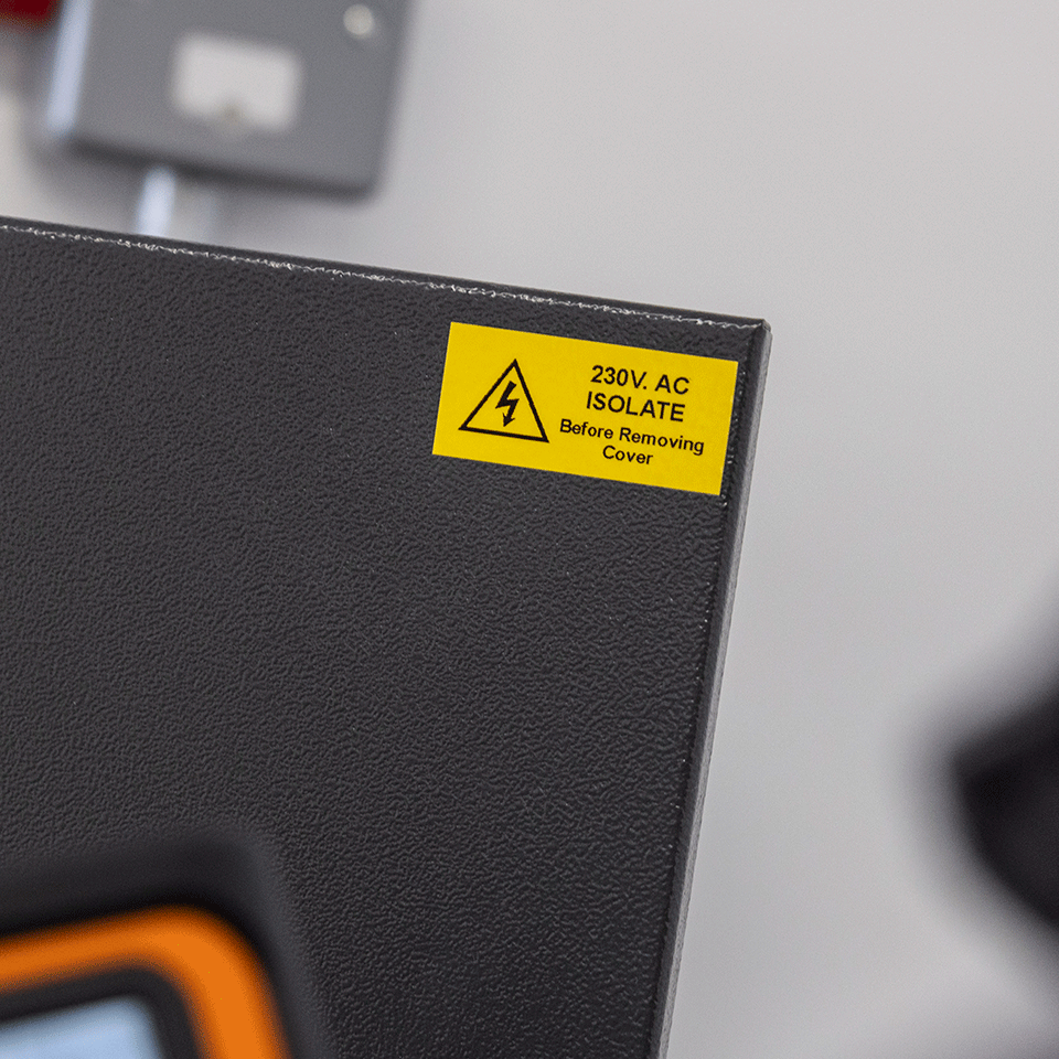 yellow warning - do not isolate label on electrical unit using black on yellow strong adhesive tape 