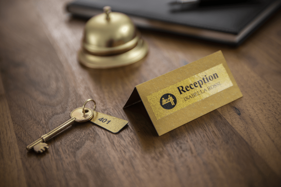 Brother TZe-PR851 premium laminated tape cassette - black on glitter gold - hotel reception sign and hotel room door key 