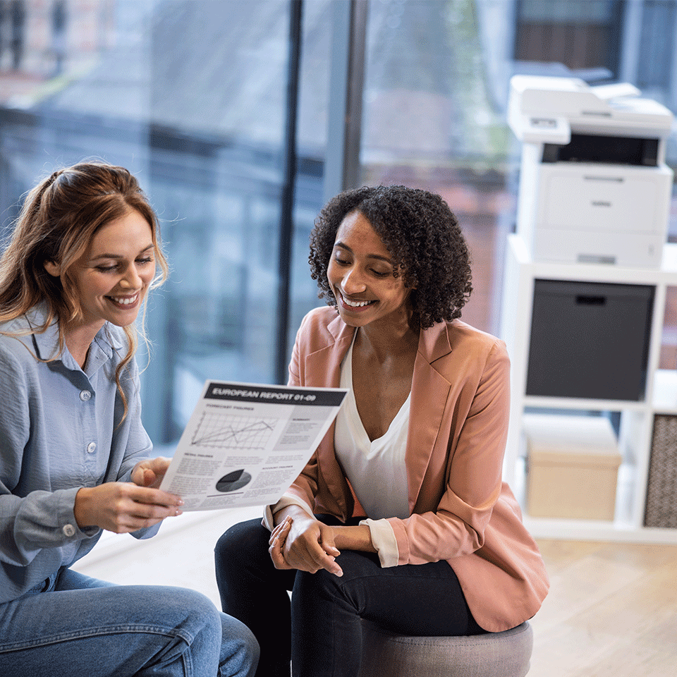 Two women talking holding mono document, Brother MFC-L5715DN