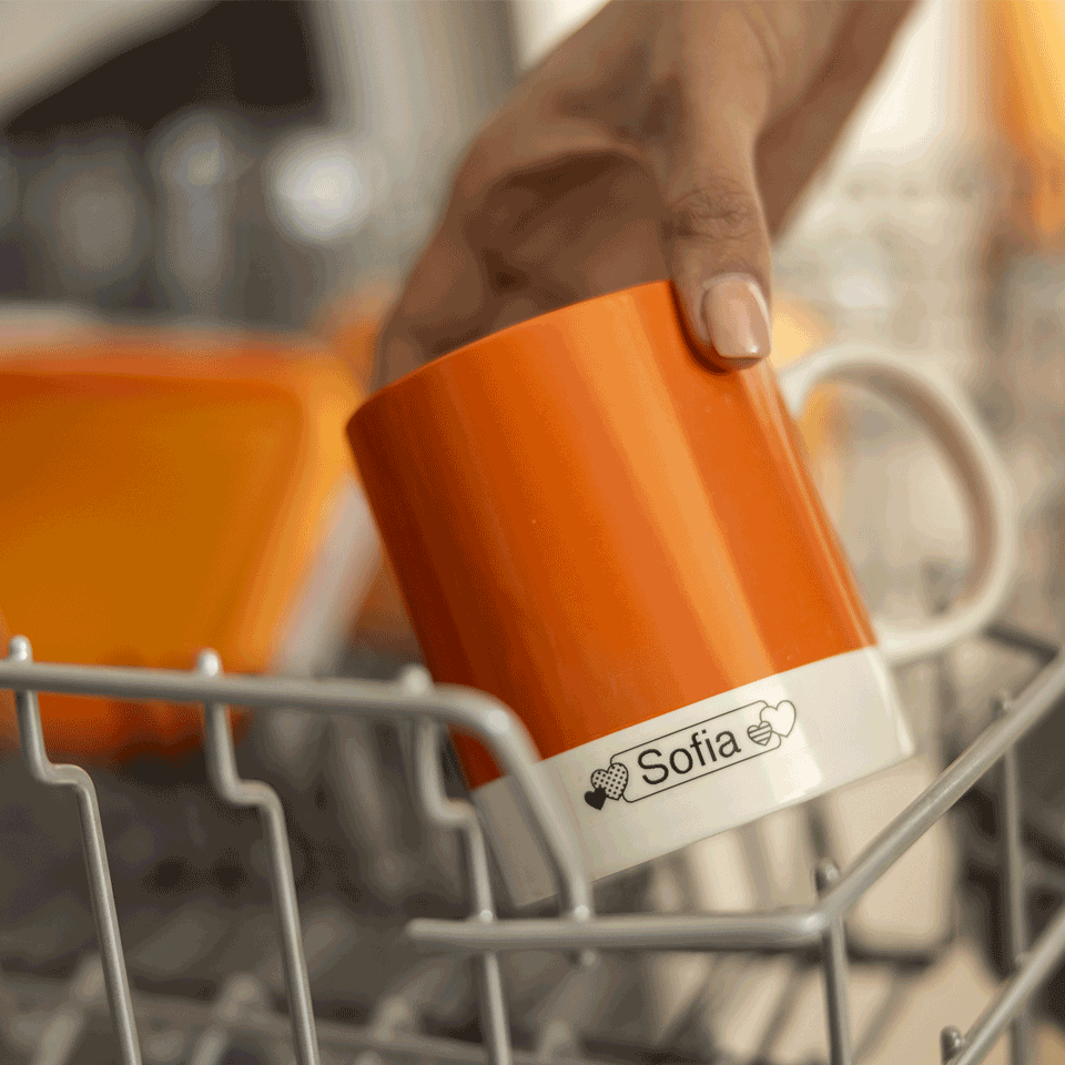 <p>Mug being placed in dishwasher with name tag using Btag-231 Black on white 12mm tape&nbsp;</p>