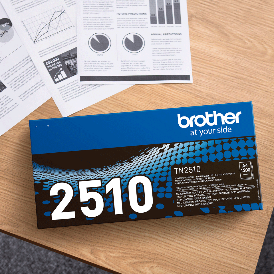 TN2510 toner box on desk with print outs