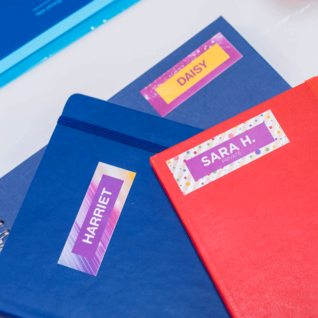 Notebooks labelled with staff names (printed on 25mm CZ-1004 full colour label roll)