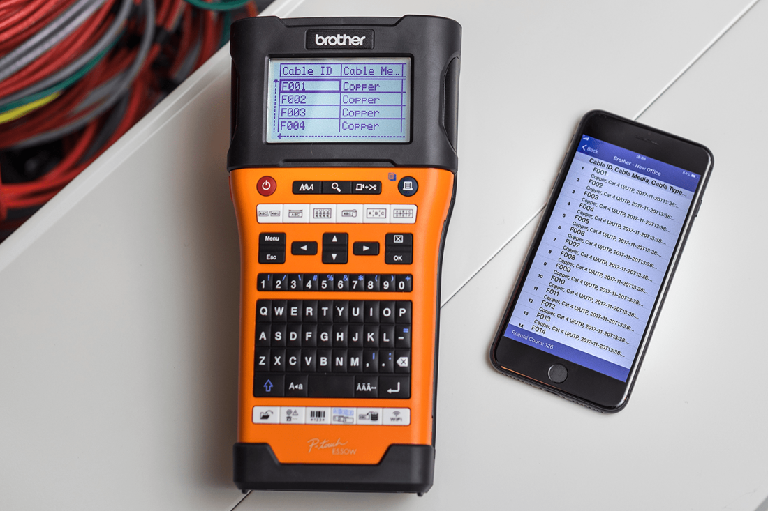 Brother PT-E550WNIVP label printer connected to the iLink&Label app on smartphone