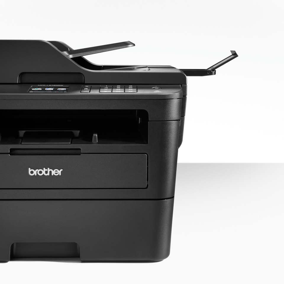 Compact 4-in-1 mono laser printer closeup with shadow