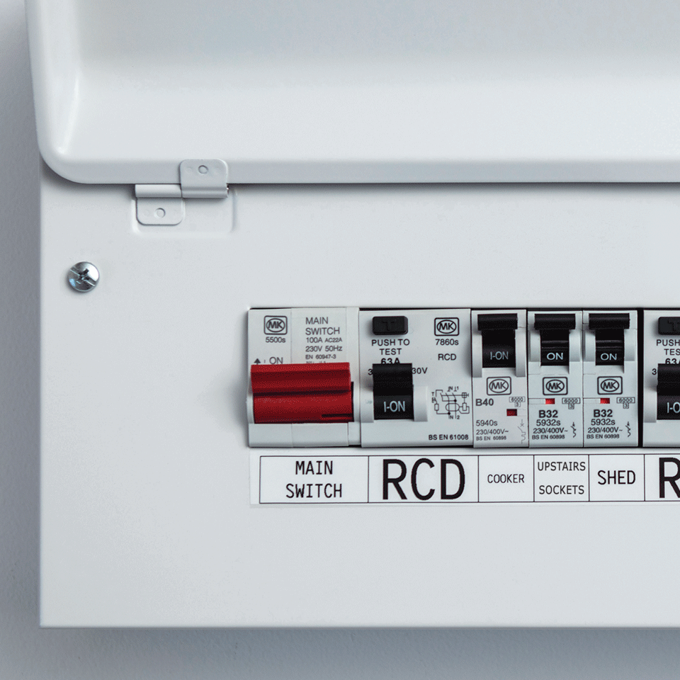 consumer unit switches clearly identified with labels using Brother strong adhesive tape. 