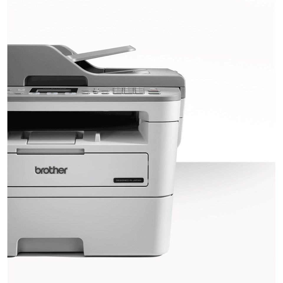 Brother 4-in-1 mono laser MFC-B7715DW printer facing forward with horizon line