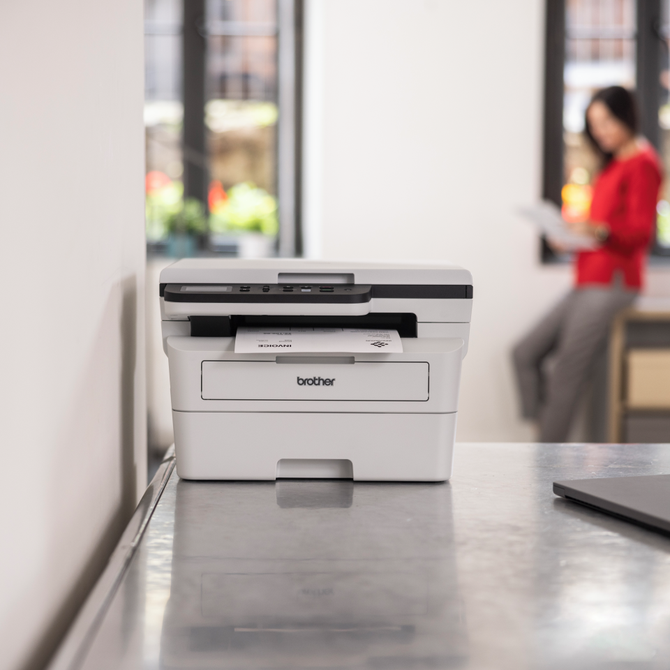 <p>DCPB7620DW on a desk in a home office</p>