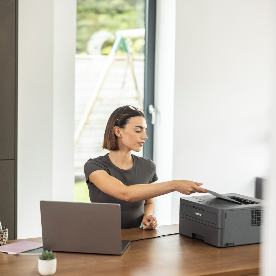 HLL2420D in a home office being operated by a woman