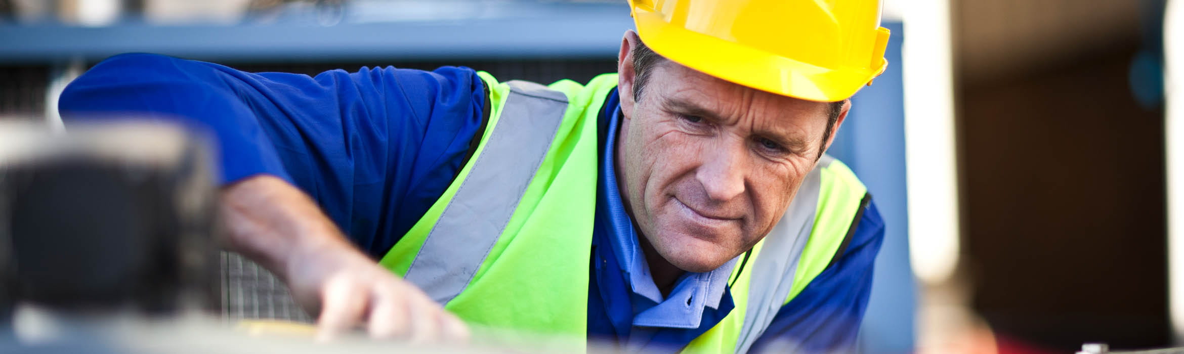 Man in a hardhat and high vis