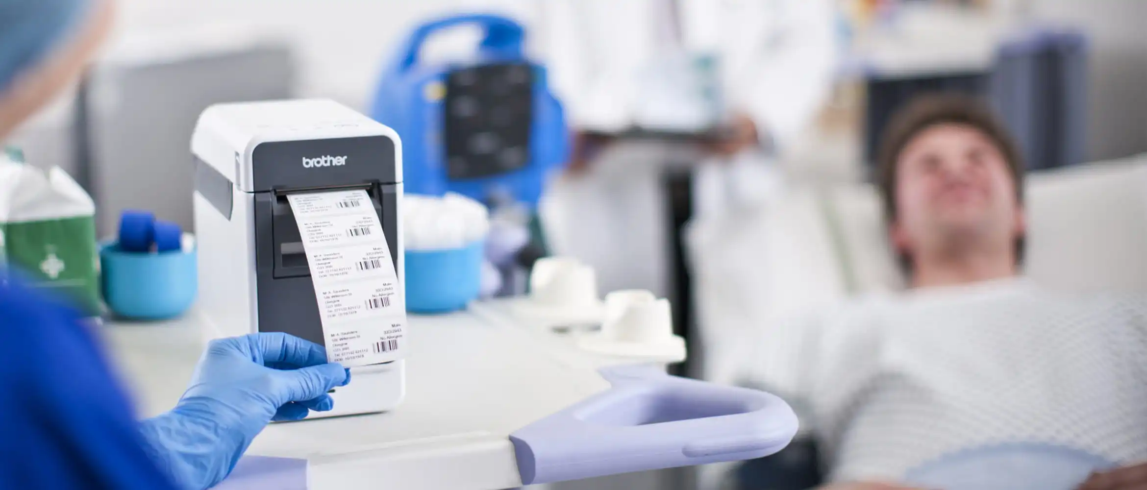 Nurse printing labels bedside