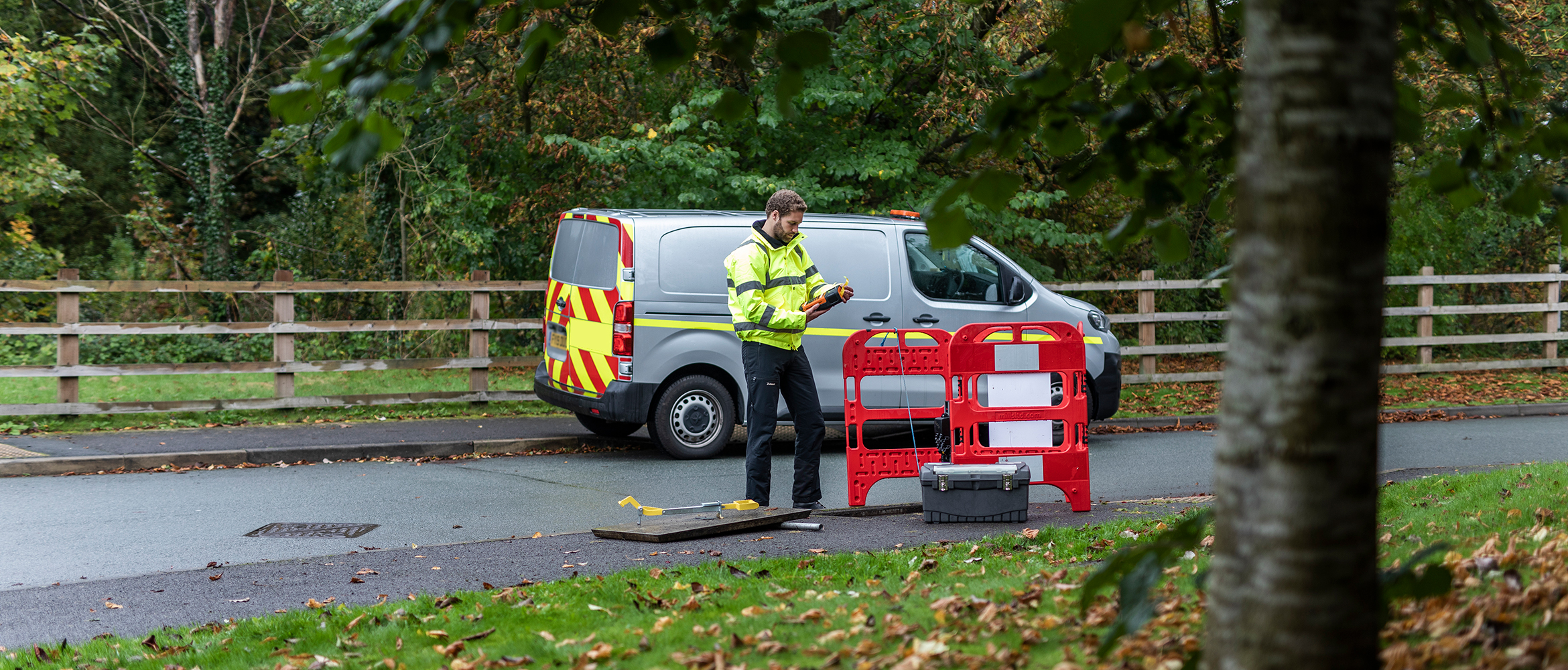 Engineer using a P-touch label printer on a fibre installation project