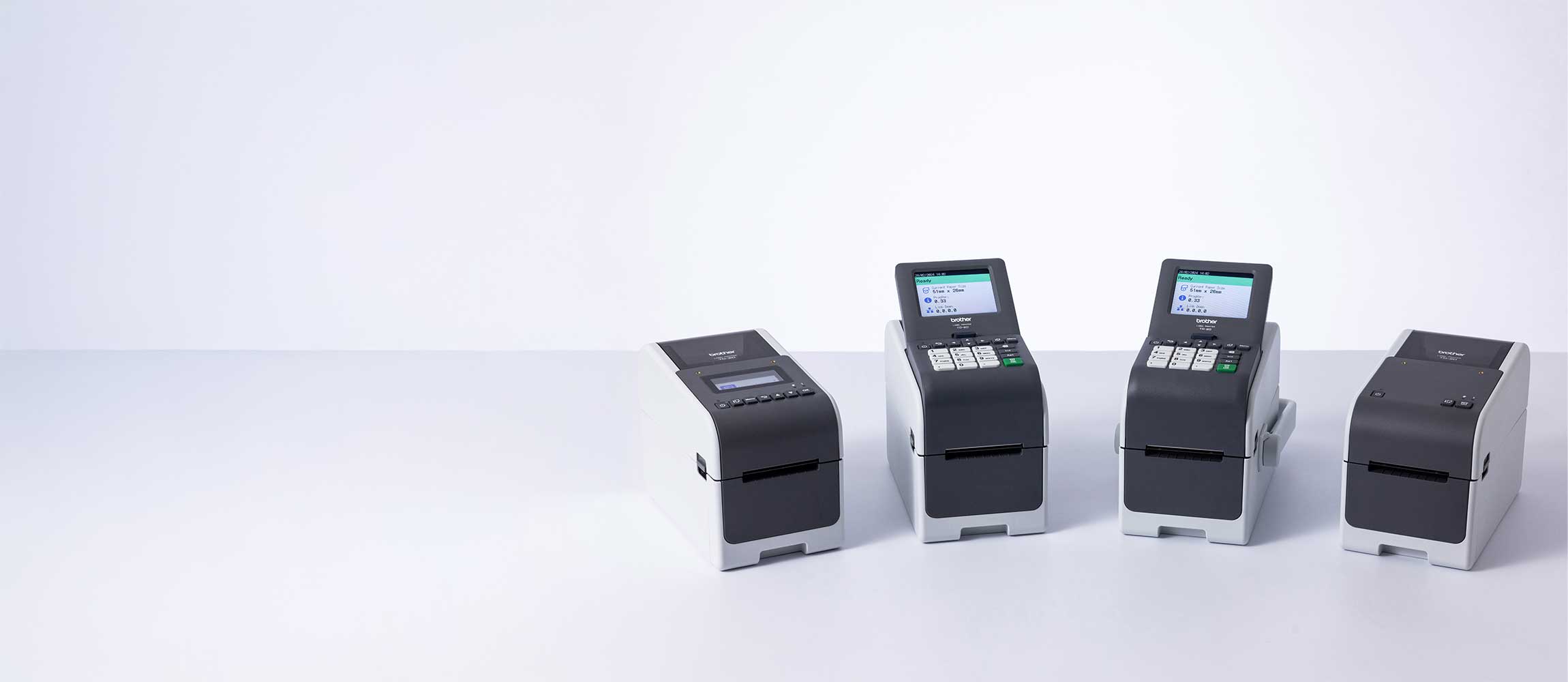 Brother TD-2D series mid volume desktop label printers lined up on a white surface