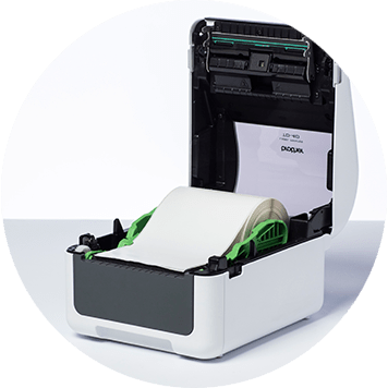 Brother TD-4D desktop label printer open with label roll inside