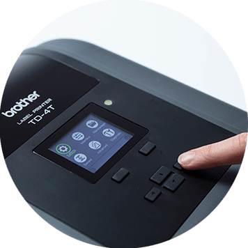 Brother TD-4T desktop label printer with finger pressing buttons