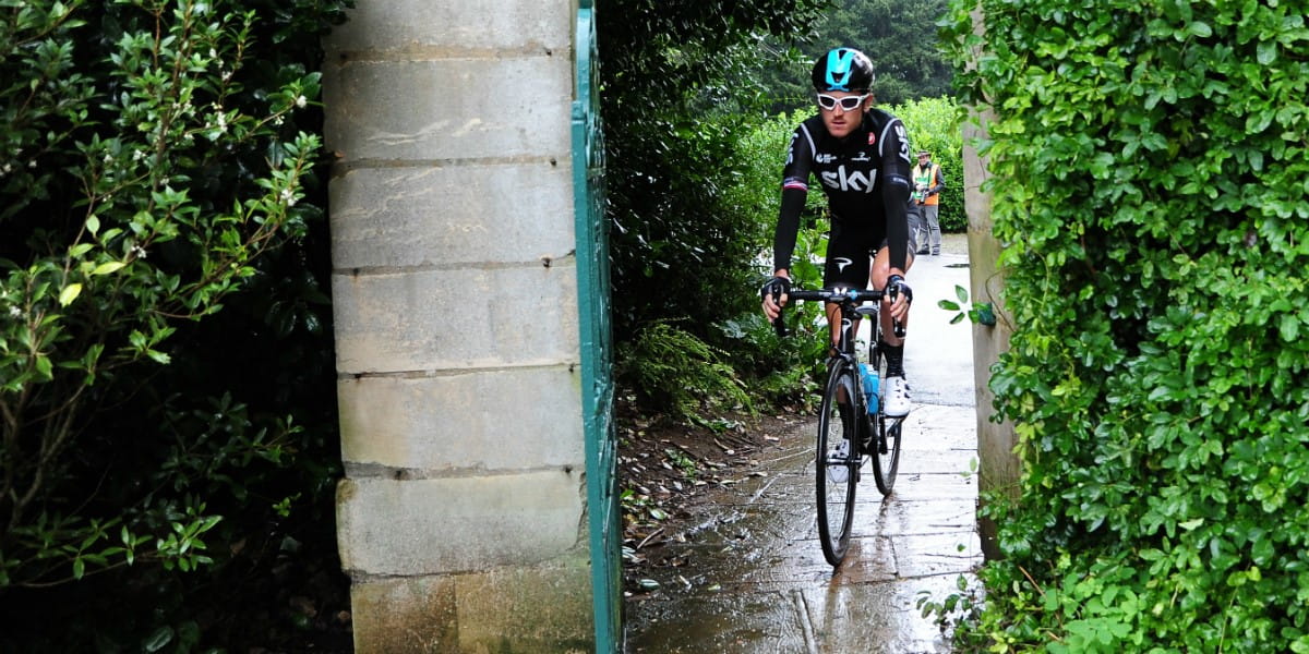 team sky cyclist cycles through doorway