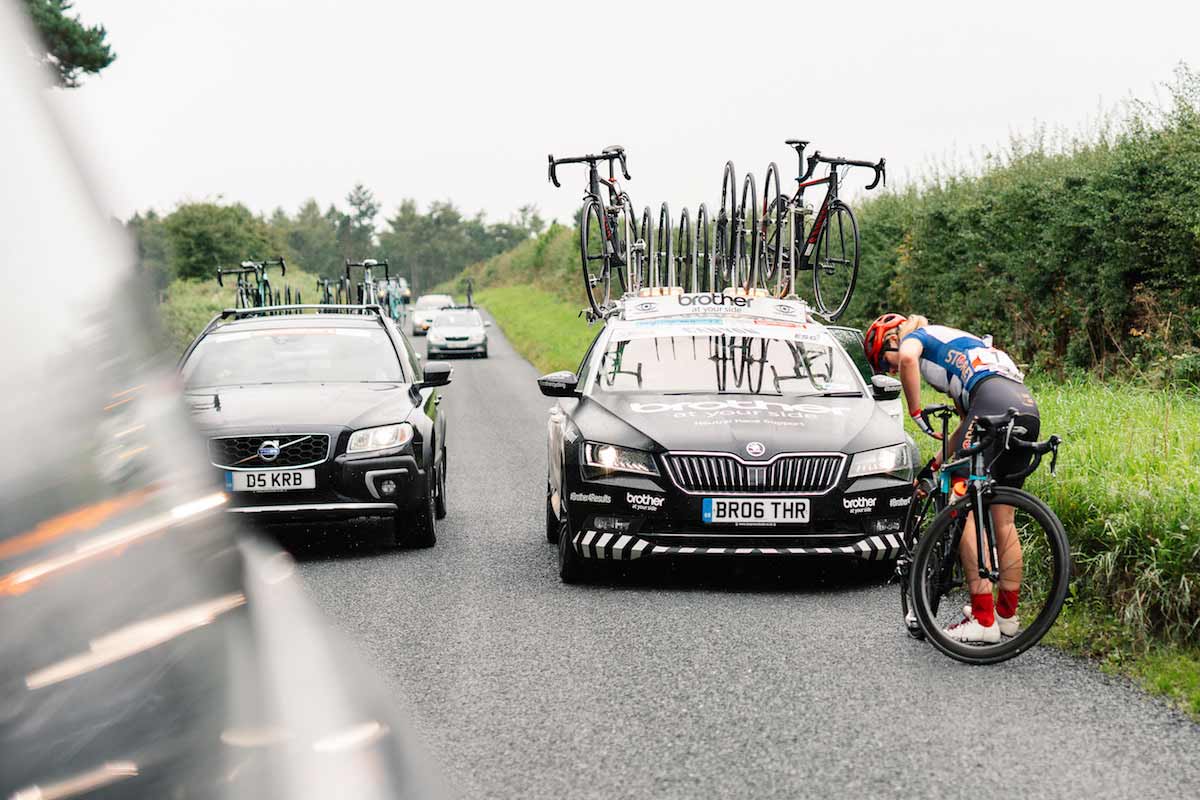 Cyclist repairing bike tyre at the side of the road