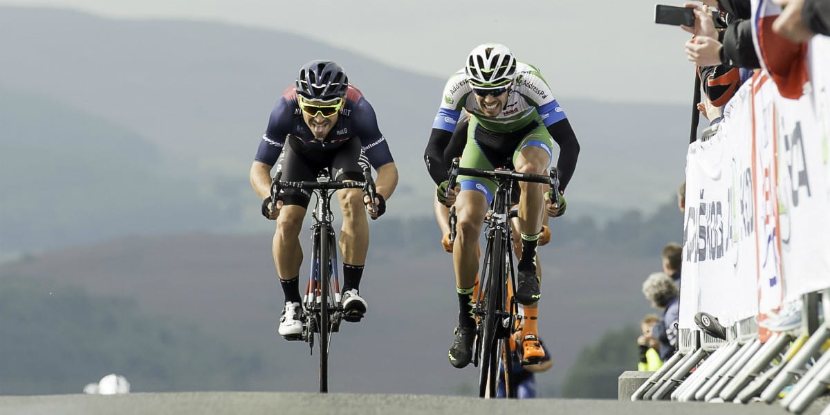 cyclists battling it out at the top of a climb