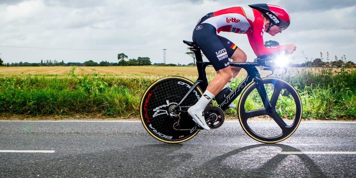 sun glints of the handlebars of bike in road race