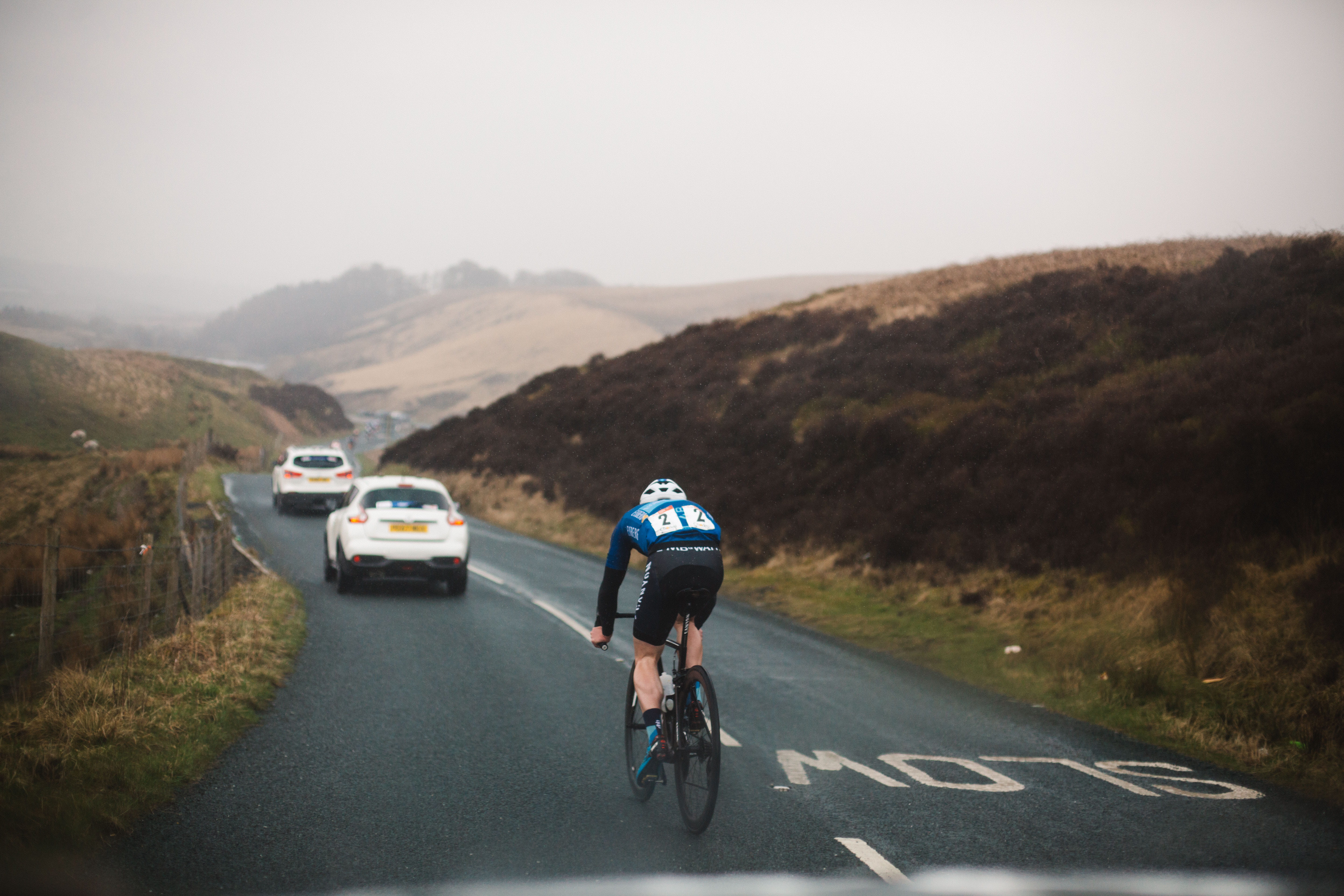Cyclist and support vehicles