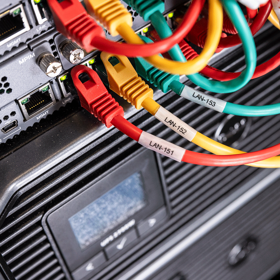 network cables clearly identified with cable numbers using  24mm self-laminating tape as cable wraps 