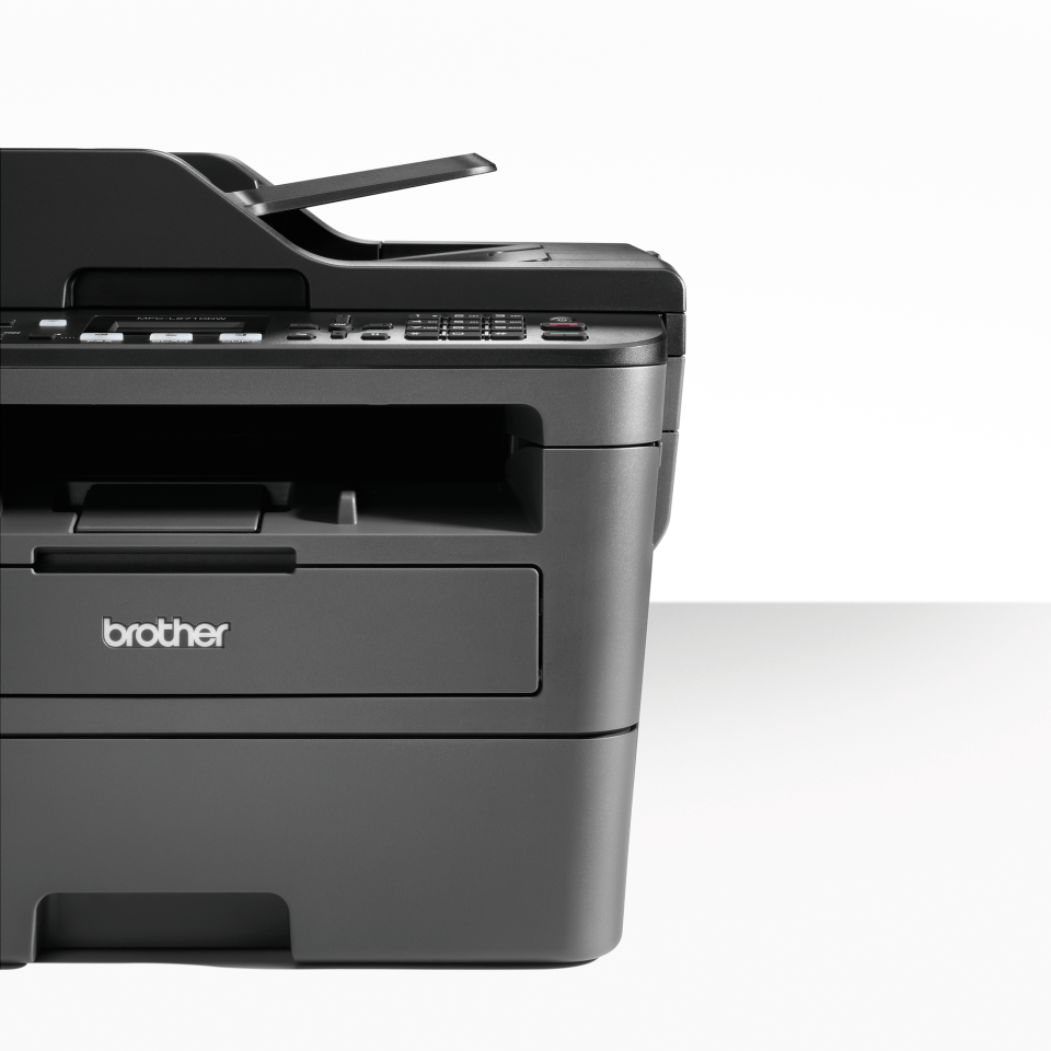 Compact 4-in-1 mono laser printer closeup of front with shadow