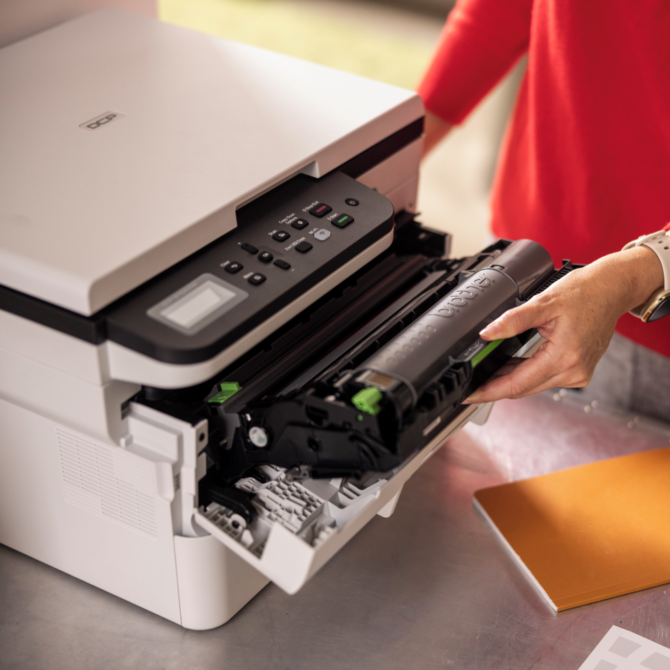 <p>Black toner being inserted into DCPB7620DW </p>