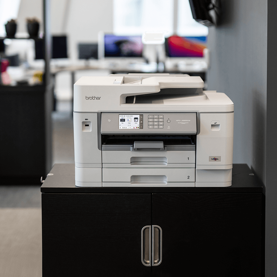 Printer in office on black cabinet