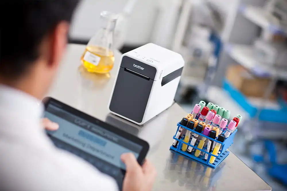 Lab technician labelling samples