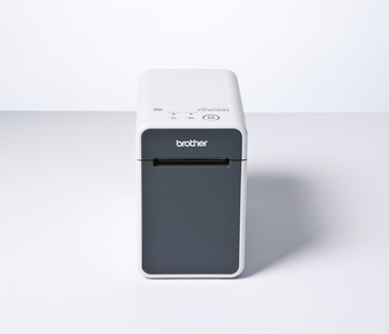 Front view of Brother TD-2130N industrial label printer on white surface and background