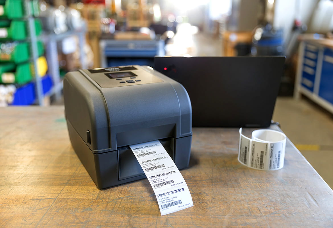 TD-4T desktop printer on a desk in a manufacturing facility