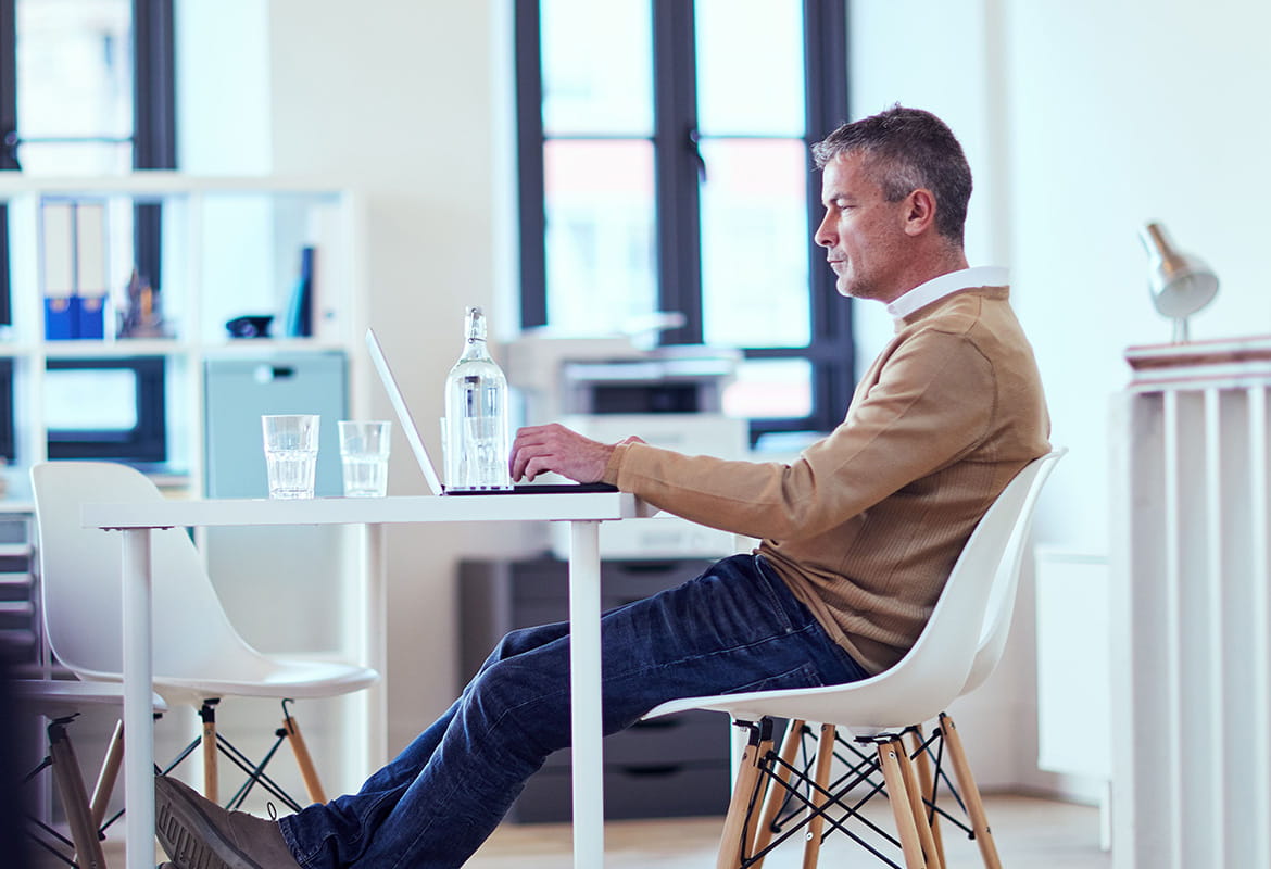 Business man on a computer in office setting