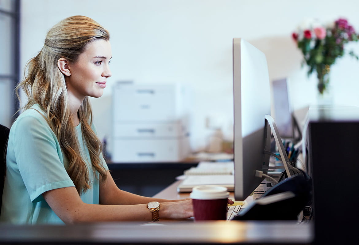 Business woman on a computer in office setting