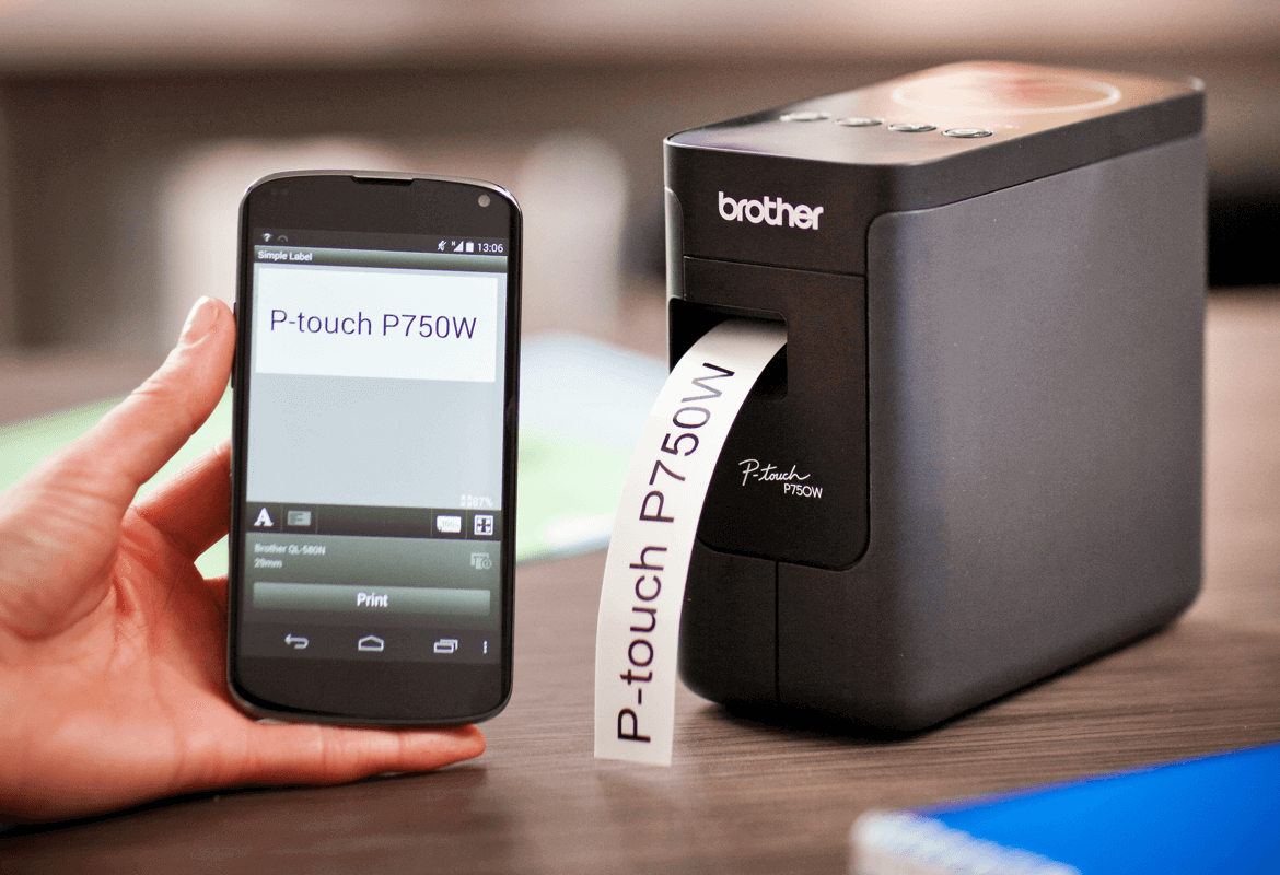 A person printing a a label from a smartphone to a Brother P-touch P750W wireless desktop label printer