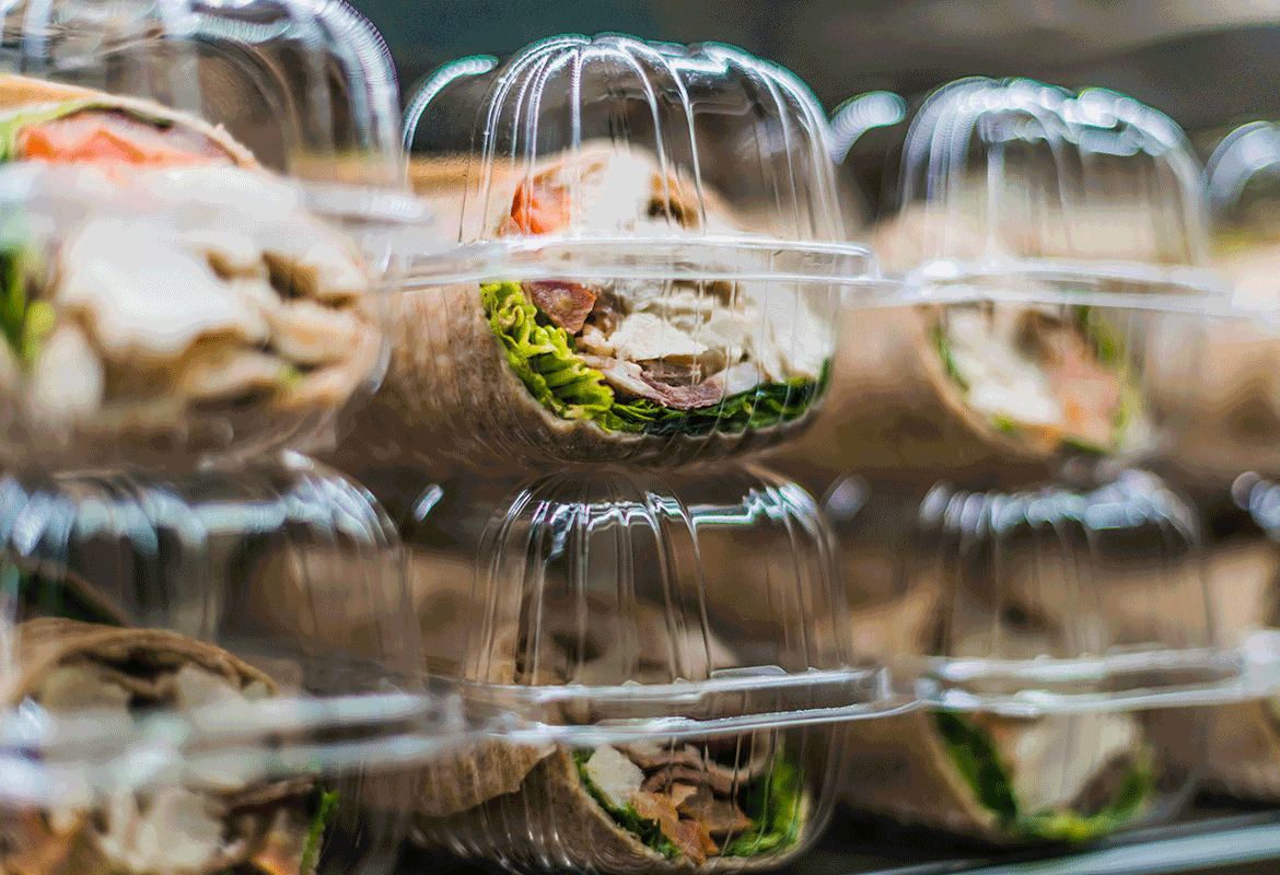 packaged sandwiches in a fridge