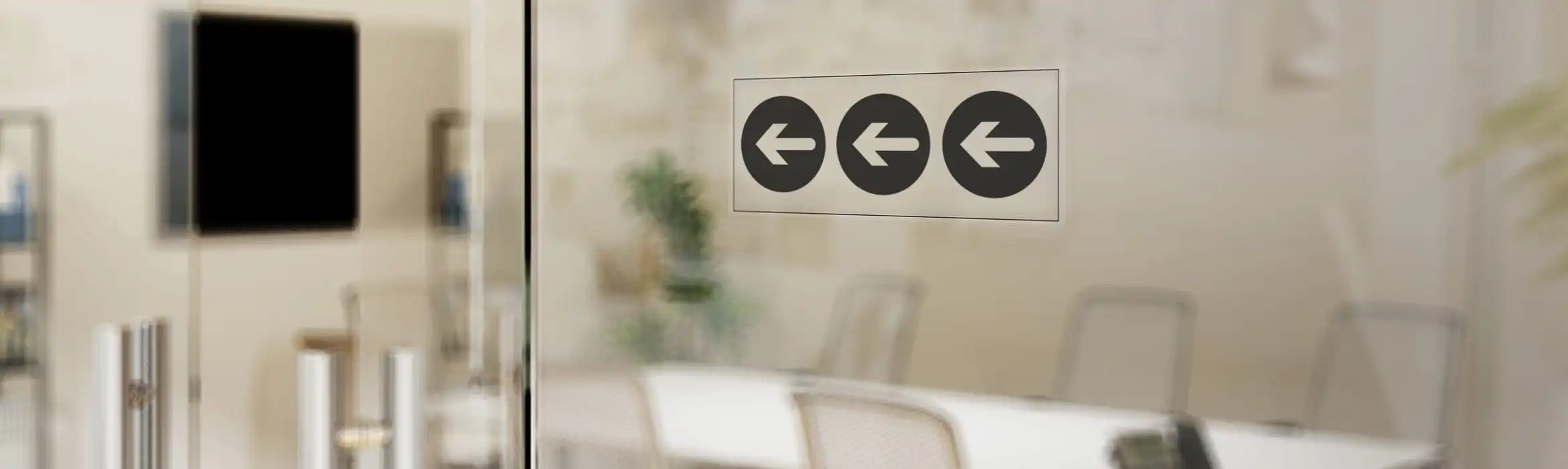 Glass office wall with arrow workflow safety signage