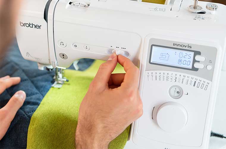 Woman sewing using Brother sewing machine