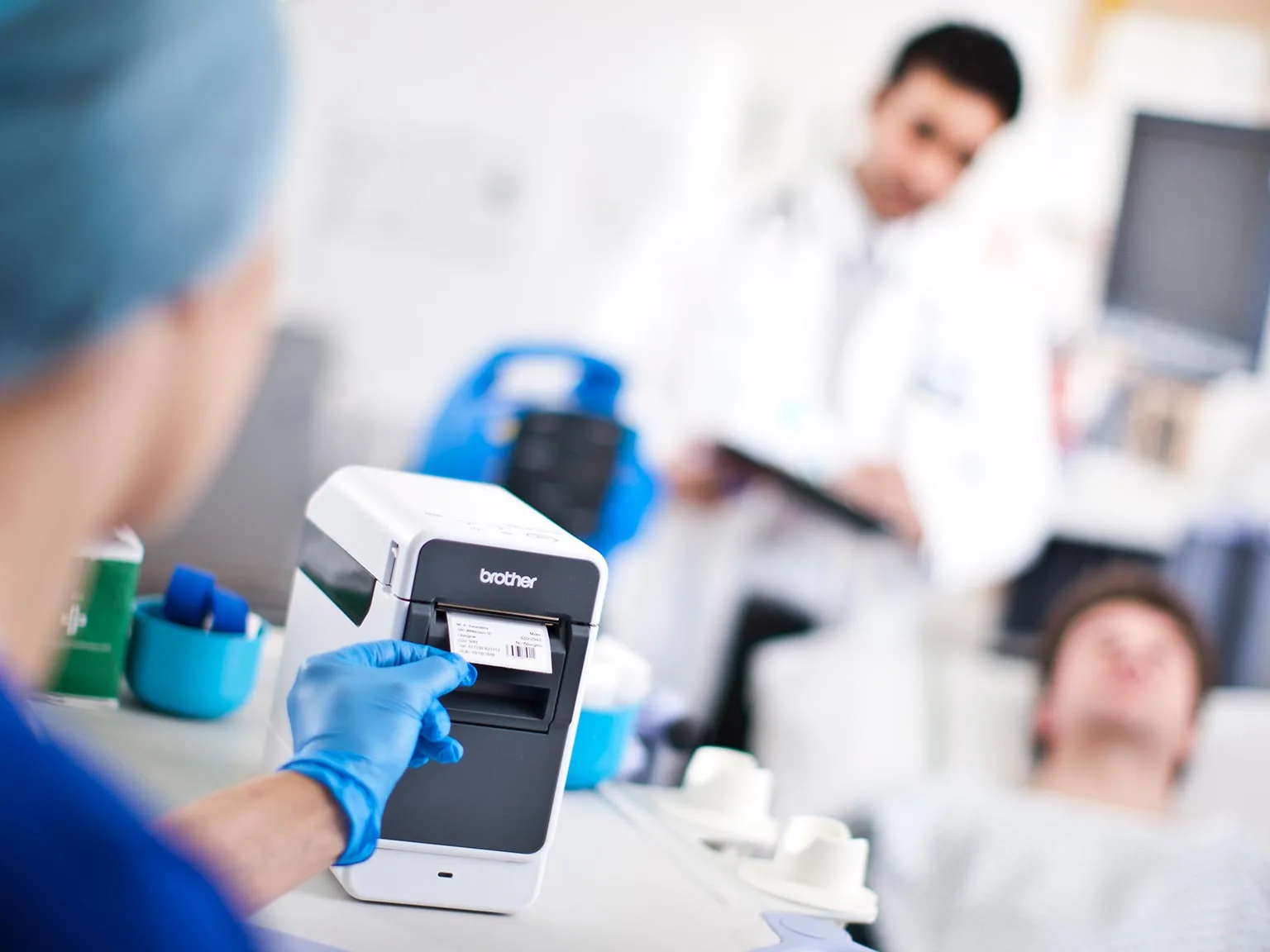 Brother TD2 series label printer in healthcare environment printing a label