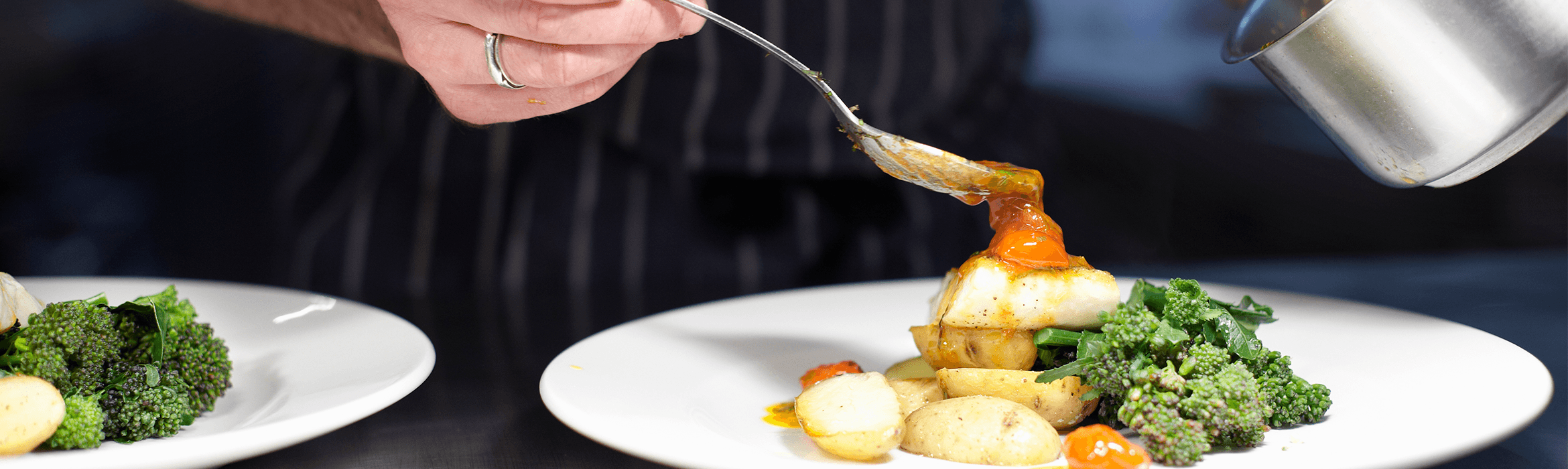 chef serving a plate of food