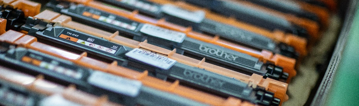 Rows of Brother cartridges in orange and black