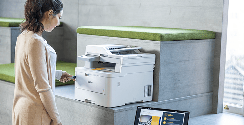 A woman printing a document from a USB flash drive in an SMB environment