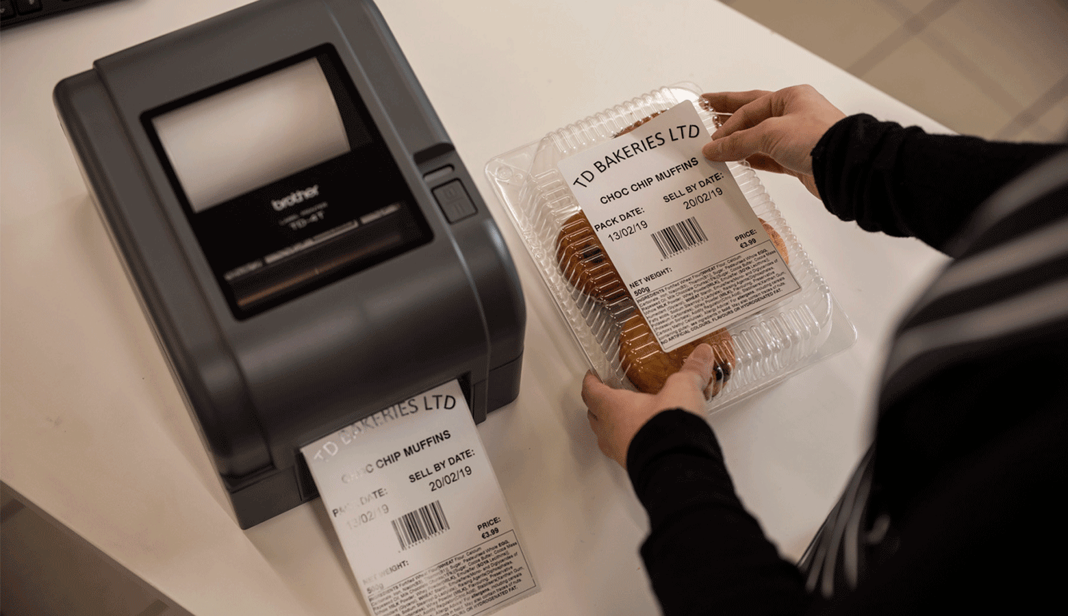 Brother TD4 label printer being used to add a label to pre-packaged food