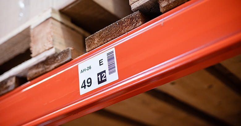 A coated label stuck on a shelf